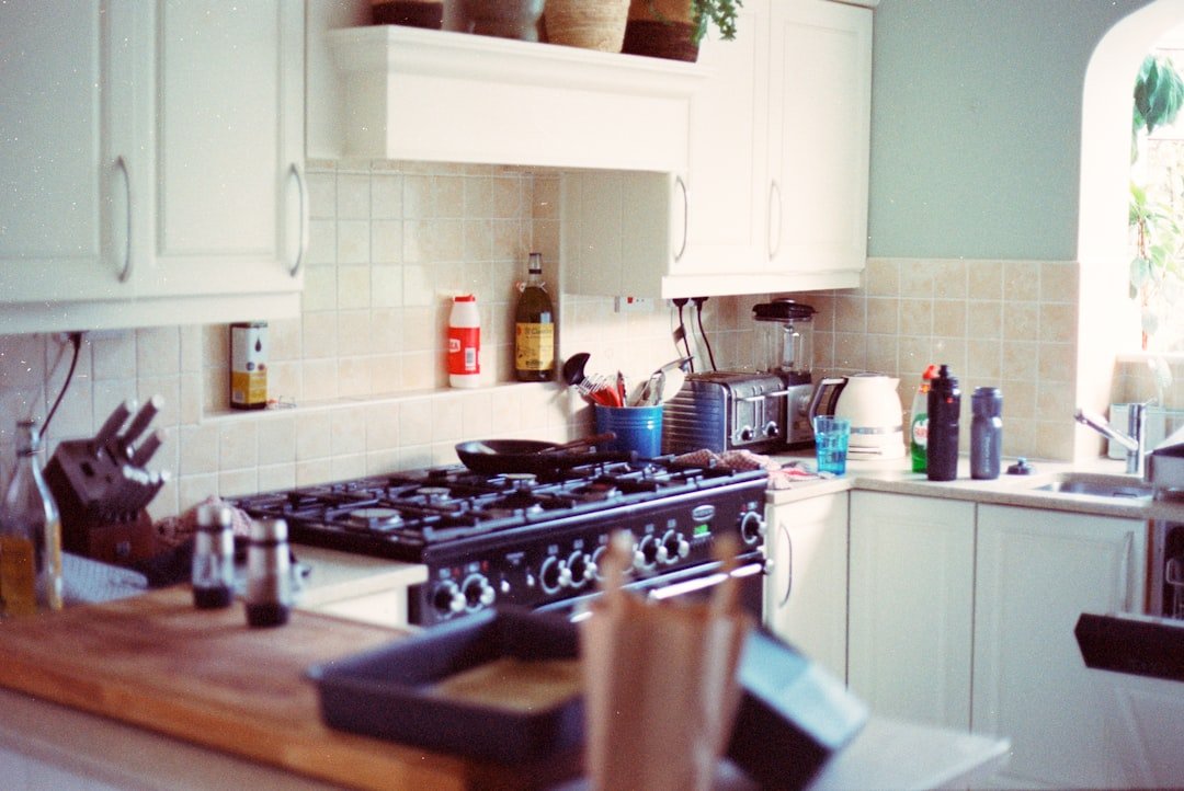 A traditional kitchen with a black gas stove